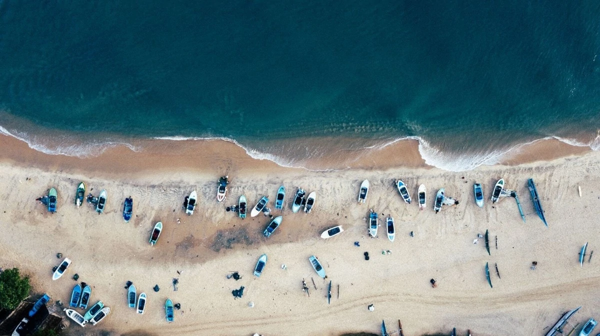 Fishing boats and surfing at Arugam Bay