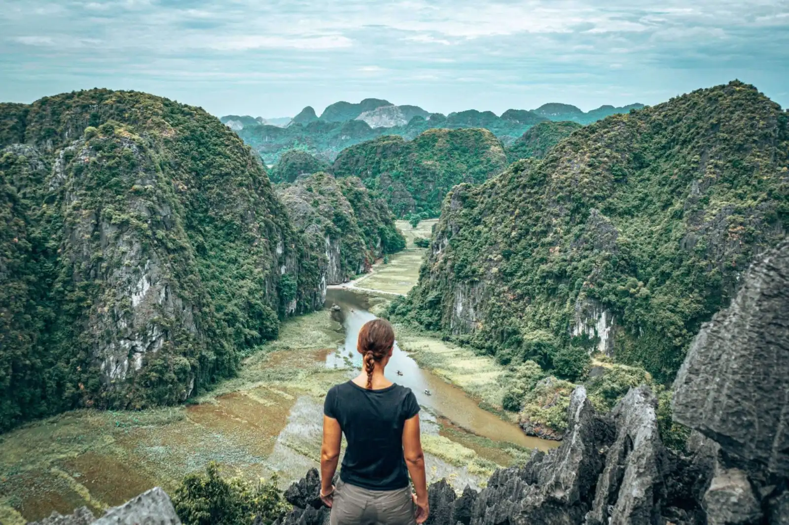 Picture of girl looking at the viewpoint from Hang Mua Cave in Tam Coc Vietnam