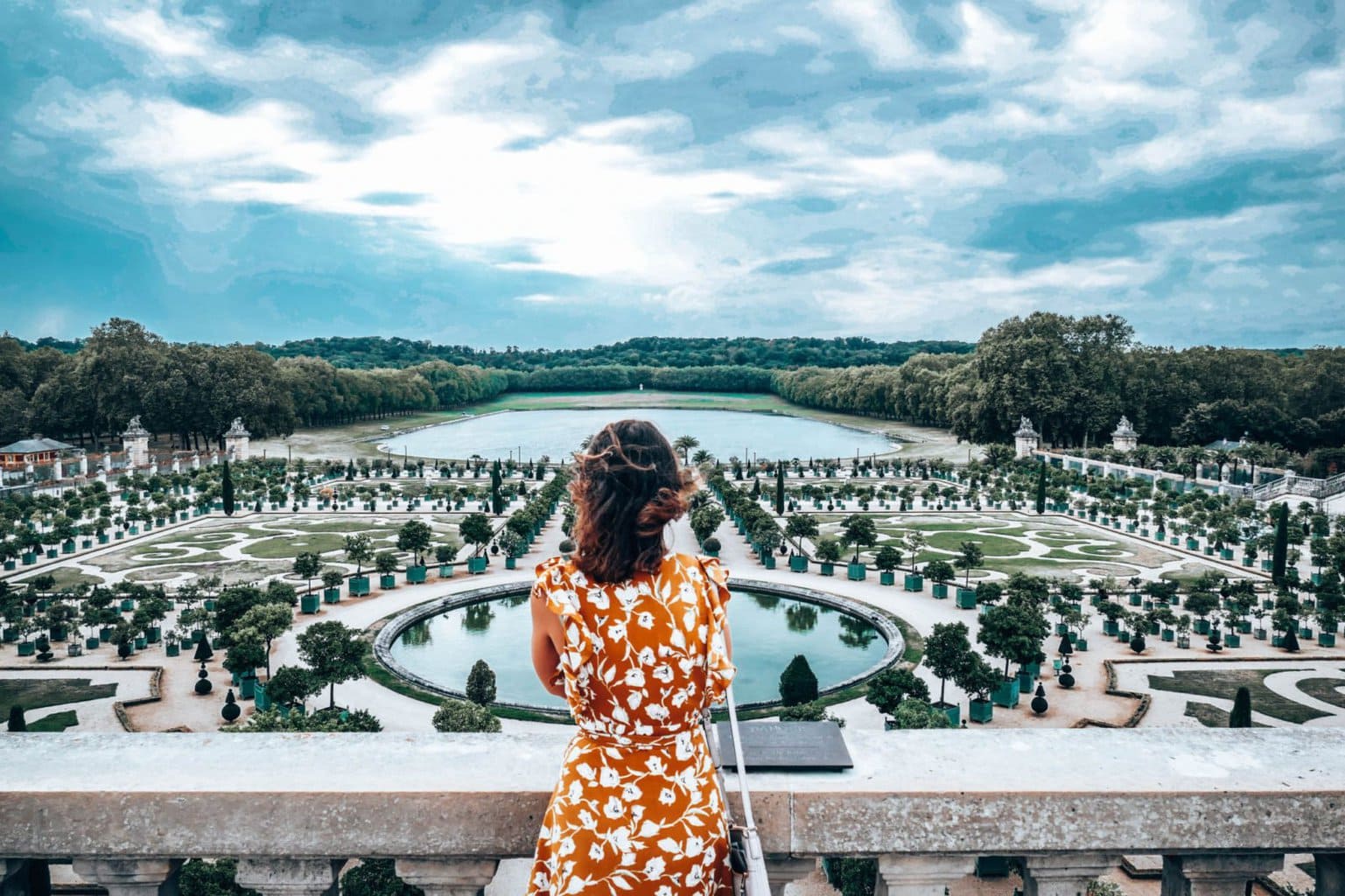 Lee looking out at gardens of Versailles